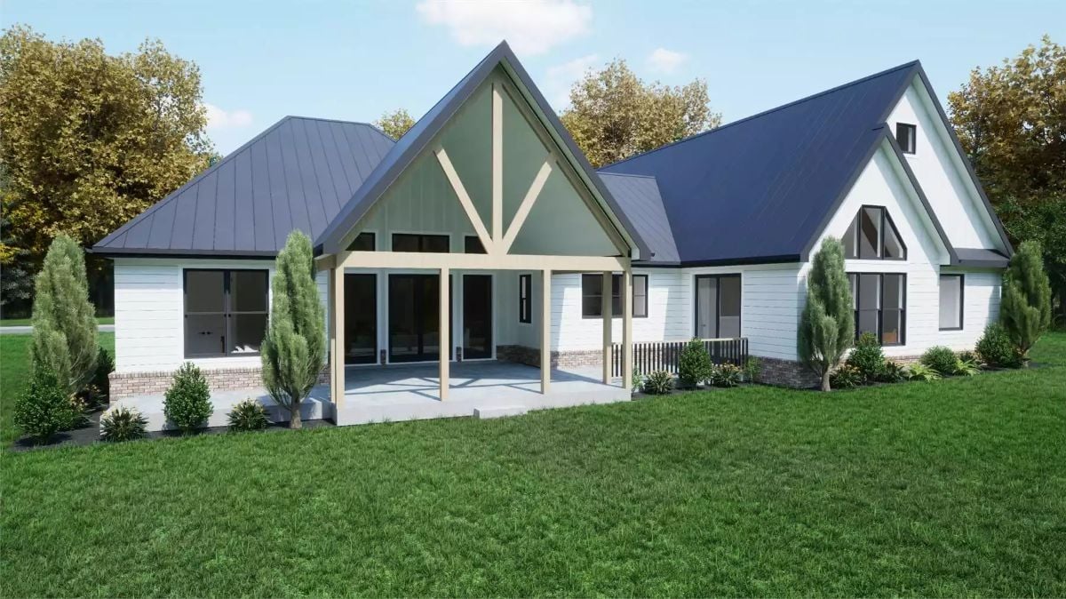 Exposed Timber Gables and Dark Metal Roofing Define This Farmhouse Rear Elevation