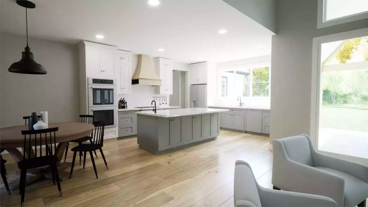 Soft Gray Cabinetry and a Shaker Island Anchor This Open Kitchen