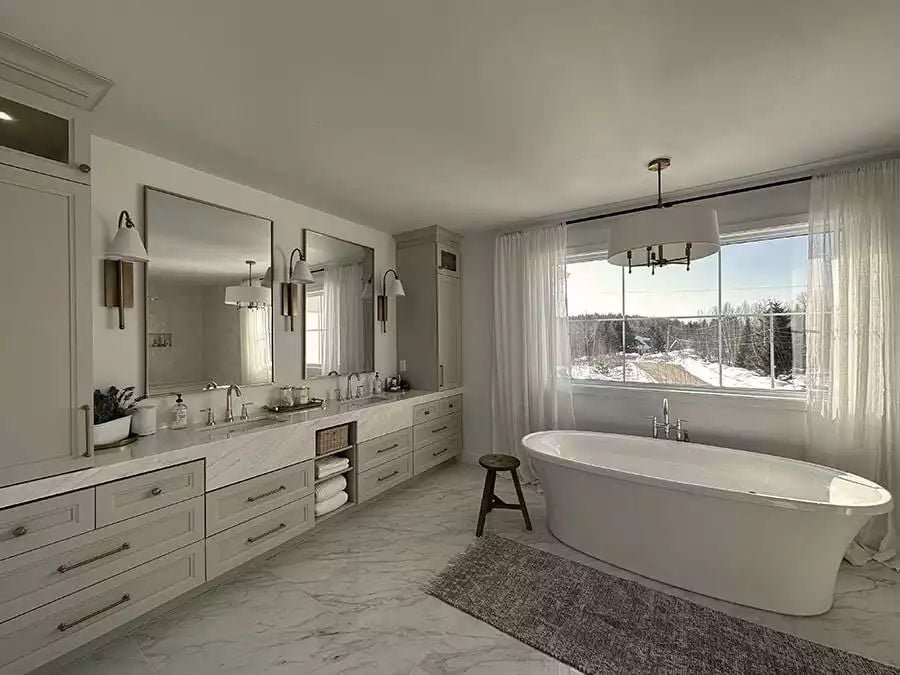 Freestanding Soaking Tub Positioned to Catch a Snow-Covered View