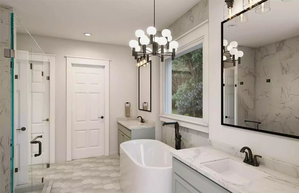 Marble Walls, Globe Chandelier, and a Freestanding Tub Centered on Natural Light
