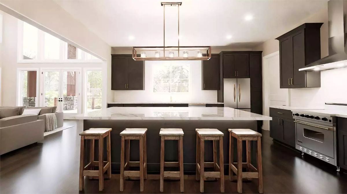 Quartz Island and Wood Stools Bring Contrast to a Dark-Cabinet Kitchen