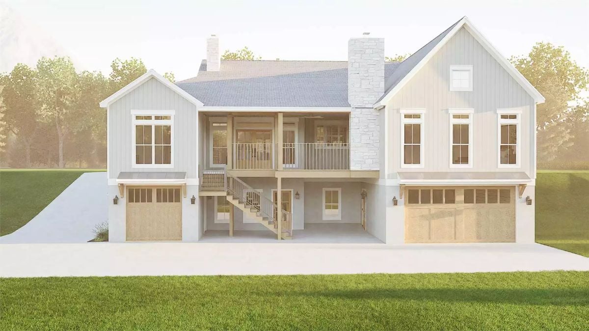 Rear Elevation Reveals Covered Porch, Triple Garage Bays, and Stone Chimney
