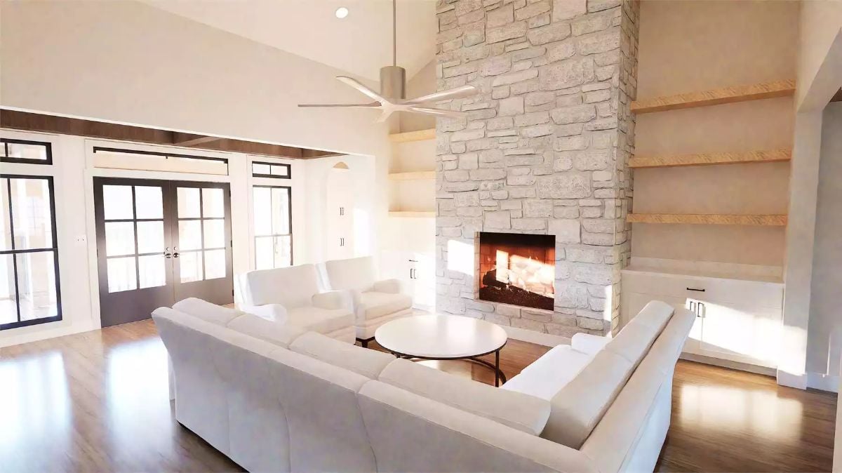 Floor-to-Ceiling Stone Fireplace Anchors an Open Living Room with Vaulted Ceilings