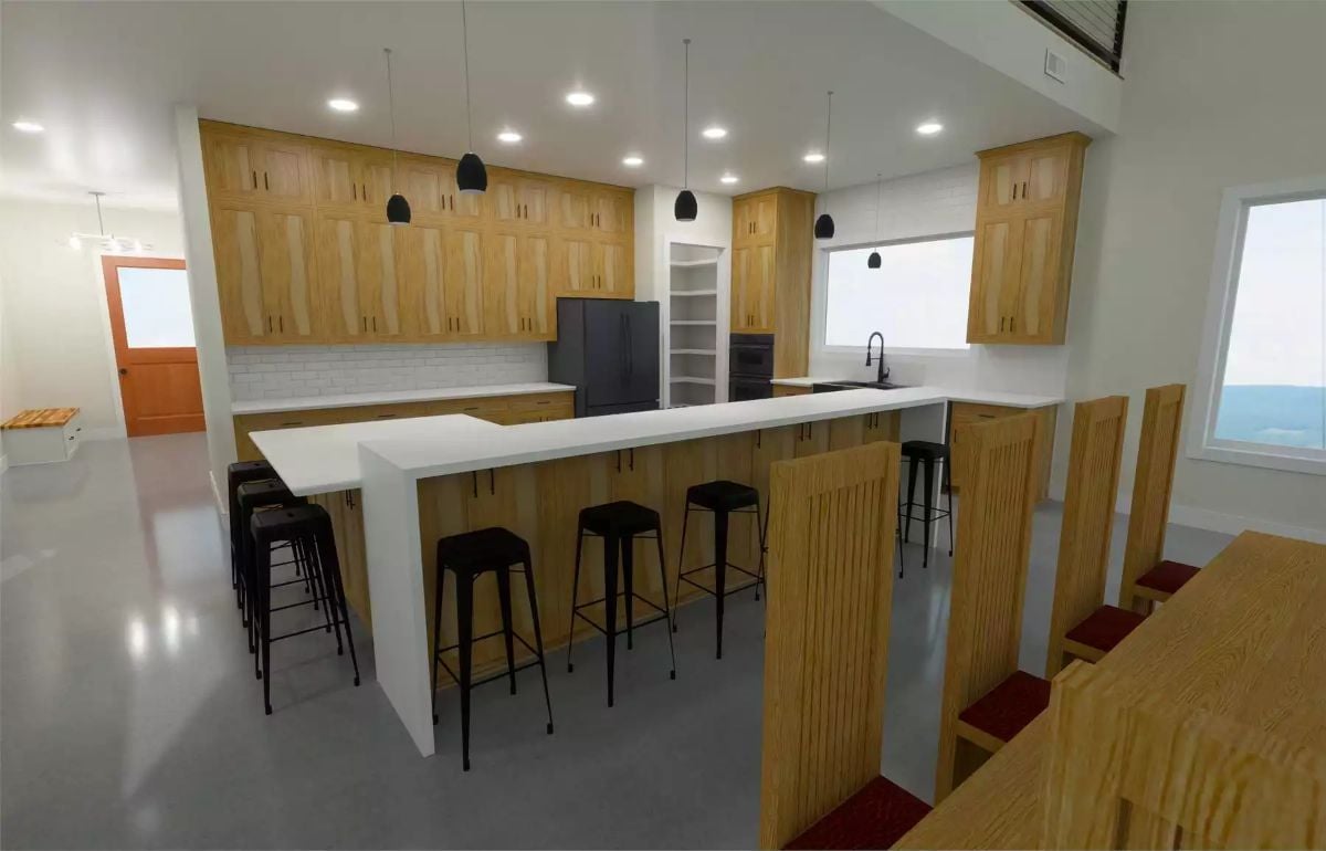 Warm Wood Cabinets and Black Fixtures Set the Tone in This Craftsman Kitchen