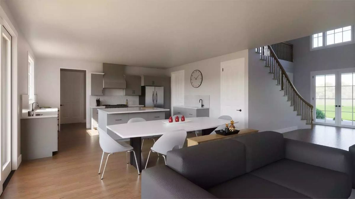 Open-Concept Kitchen and Dining Flow Toward a Curved Staircase