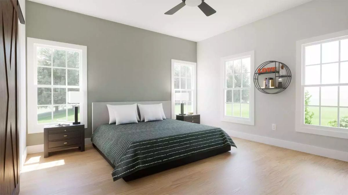 Hardwood Floors, Gray Walls, and a Low Platform Bed Centered on Natural Light