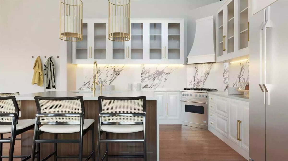 Gold Pendants and Marble Backsplash Anchor This Kitchen's Classic Character