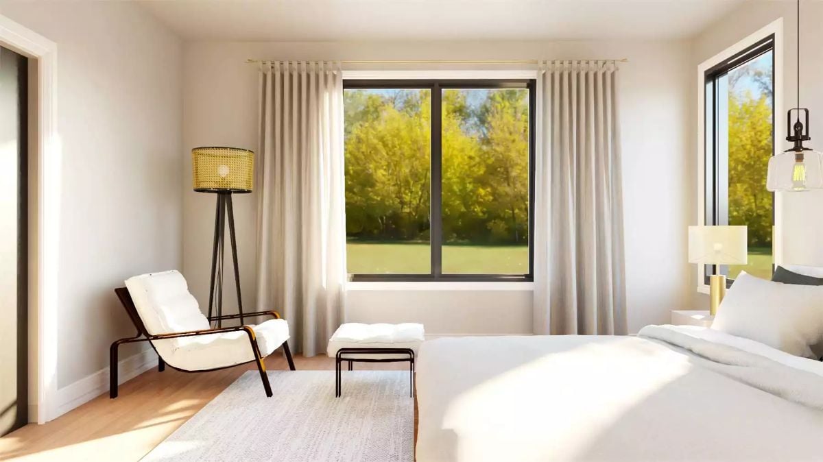 Warm Light and Linen Curtains Frame a Bedroom Built for Rest