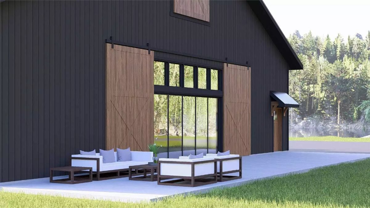 Sliding Barn Doors and Black Steel Glass Wall Define This Exterior Patio