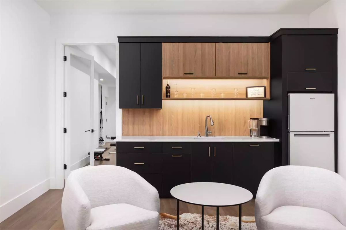 Wet Bar With Wood Backsplash and Wine Glasses Ready for Company