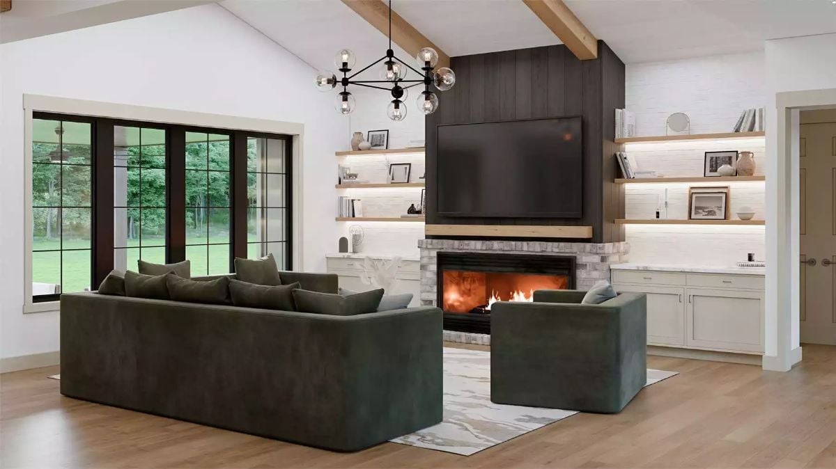 Vaulted Ceilings and Exposed Beams Frame a Fireplace-Centered Living Room