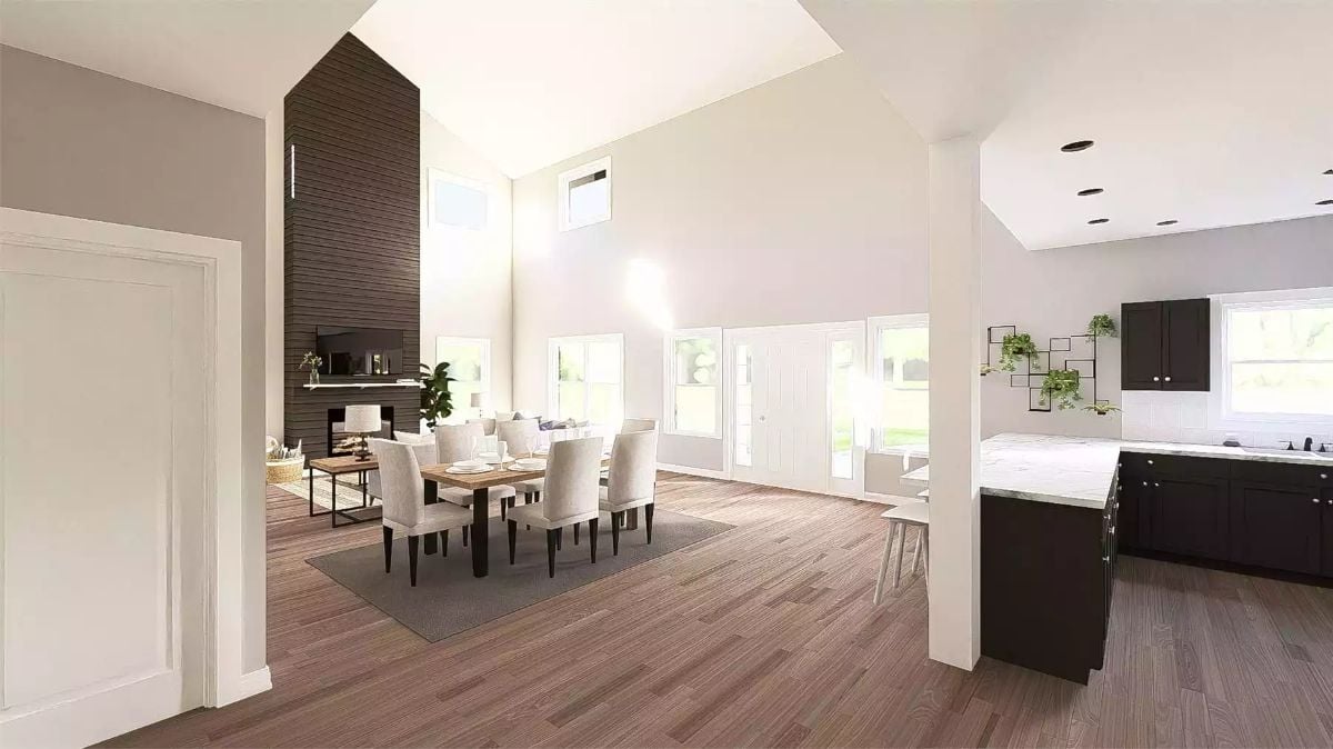 Open-Plan Dining and Kitchen Share Space Beneath Cathedral Ceilings