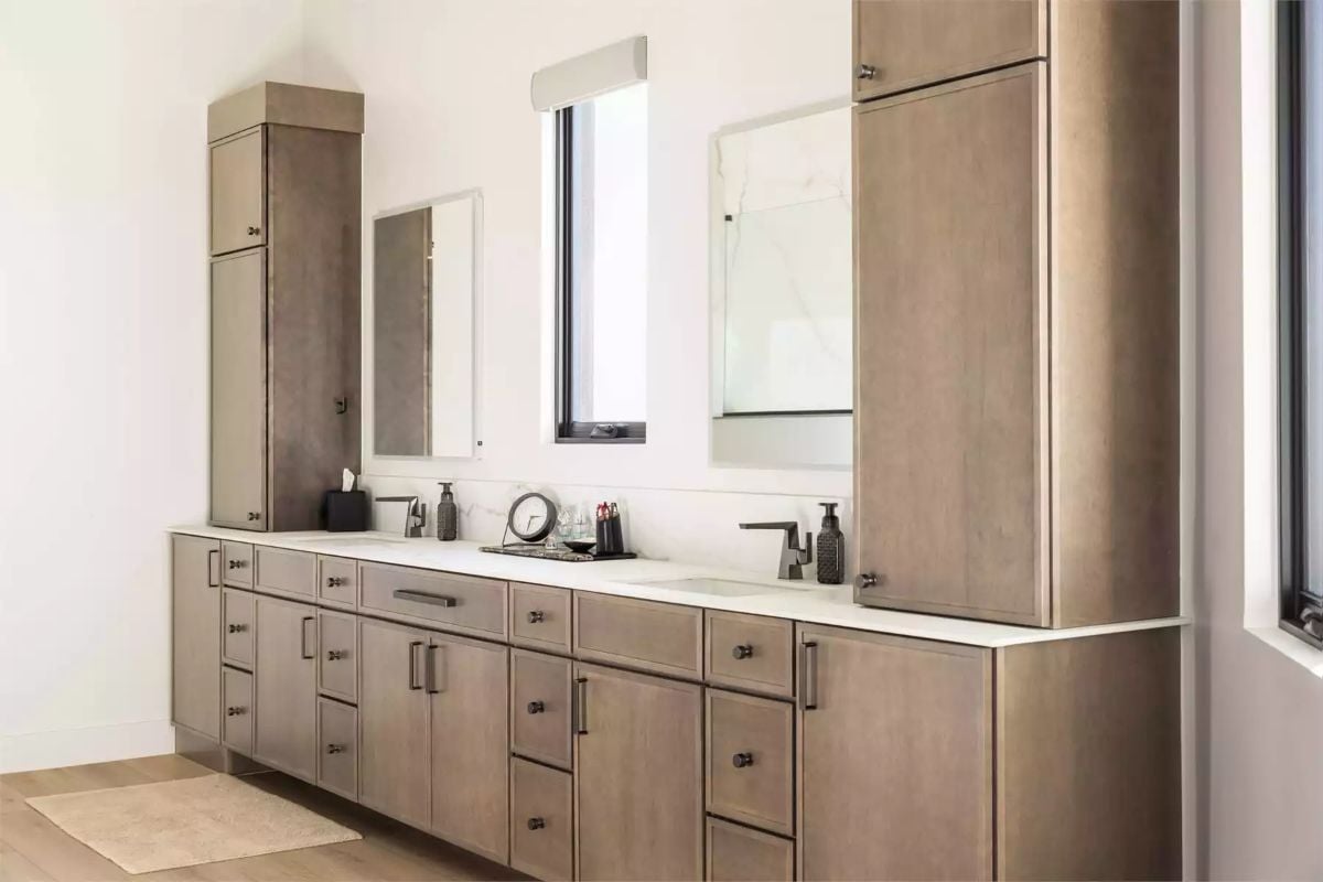 Warm Wood Tones and Matte Black Hardware Shape a Double-Sink Primary Bath