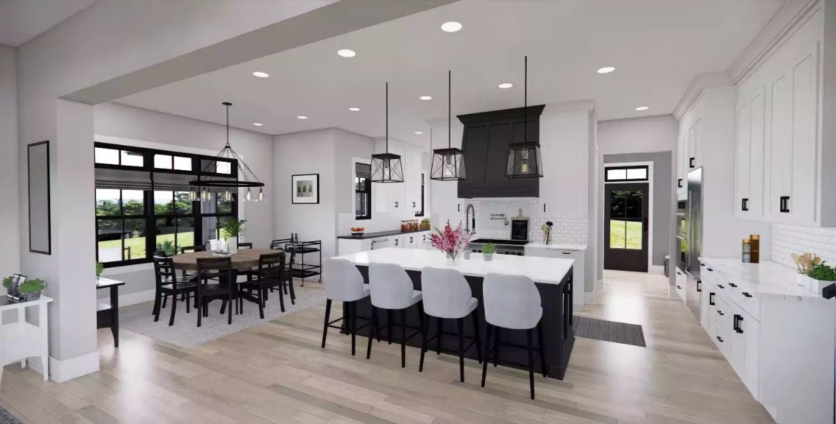 Black Island and Pendant Lights Anchor an Open-Concept Farmhouse Kitchen