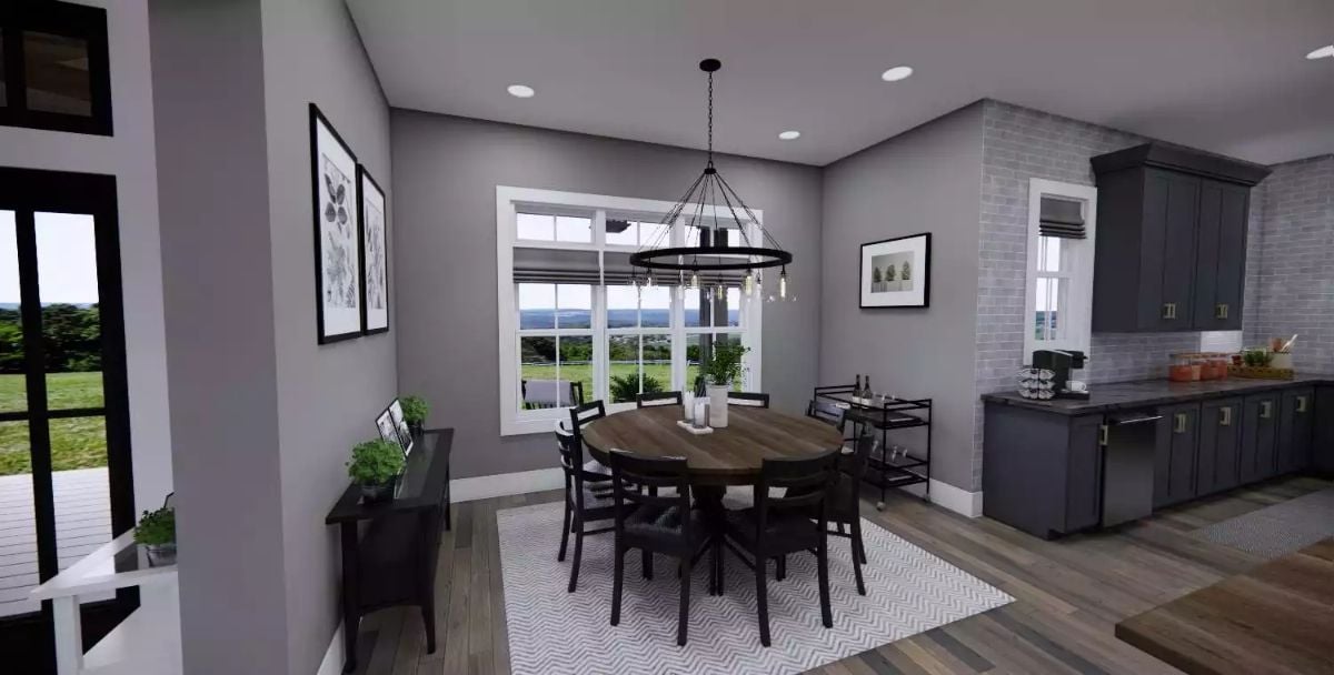 Round Walnut Table and a Chandelier Ring Pull This Dining Nook Together