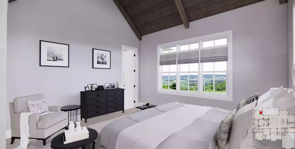 Vaulted Ceiling with Dark Wood Beams Frames a Master Bedroom Worth Waking Up In