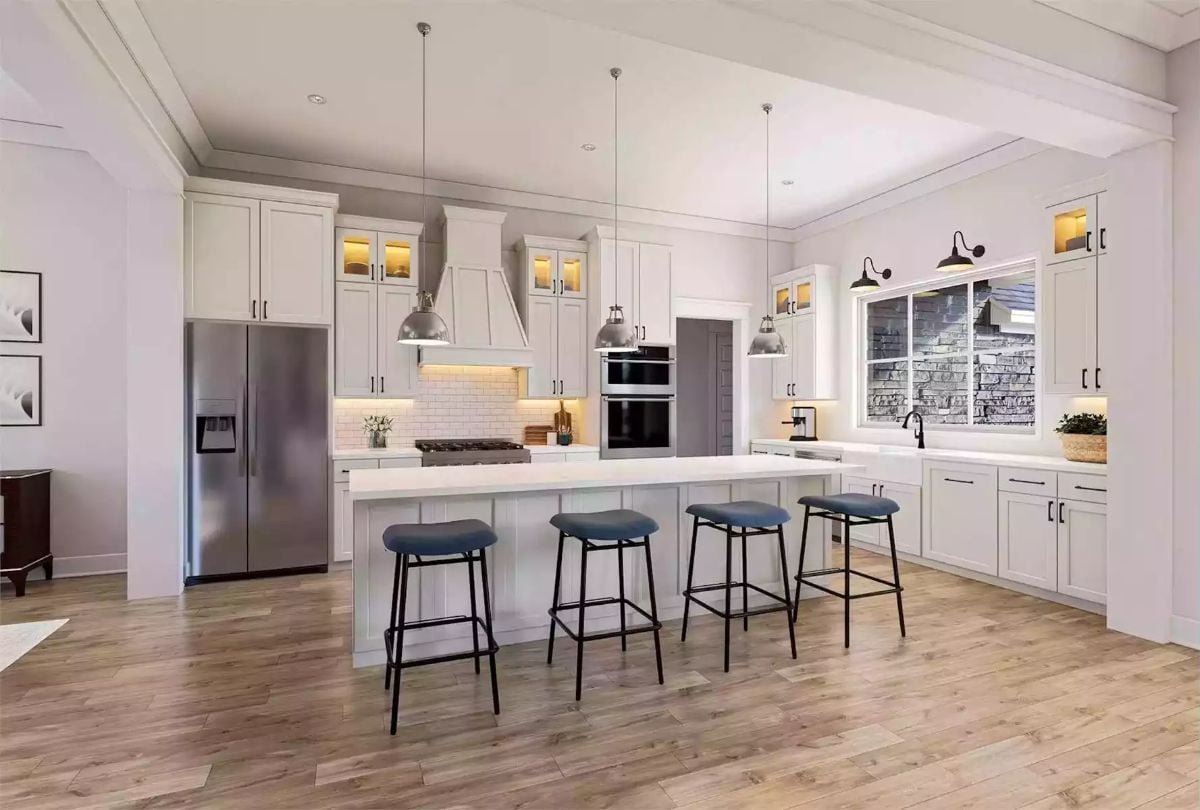 Blue Barstools and Industrial Pendants Give This Kitchen Some Edge