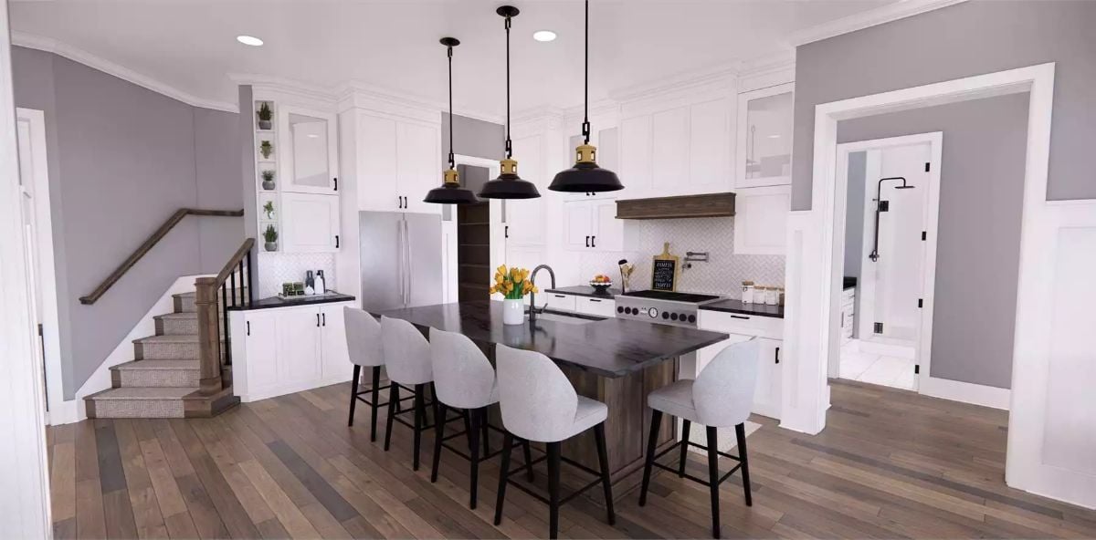 Pendant Lights and a Dark Island Counter Pull a Farmhouse Kitchen Into Focus