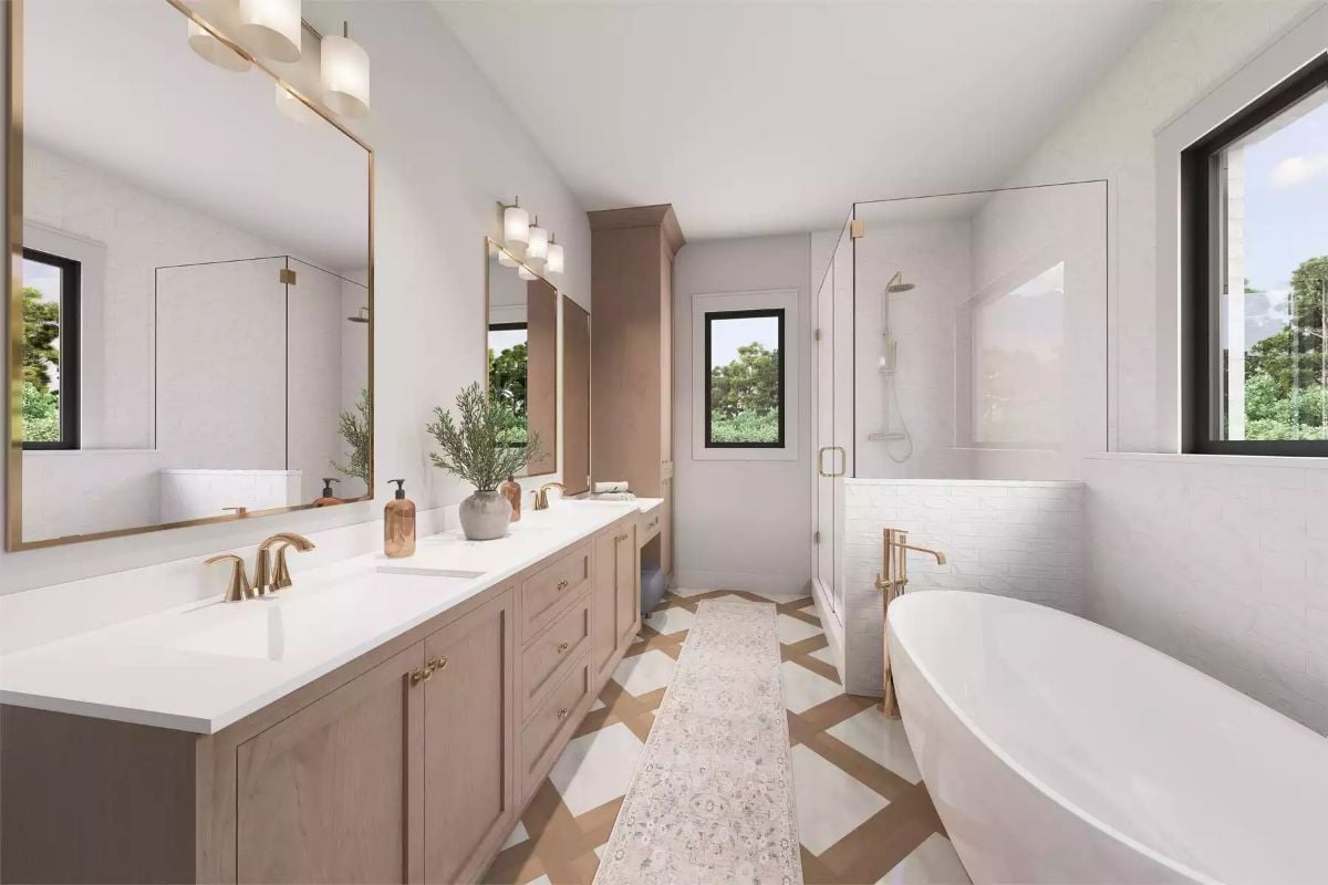 Gold Fixtures and Wood Cabinetry Give This Primary Bath a Warm, Grounded Feel