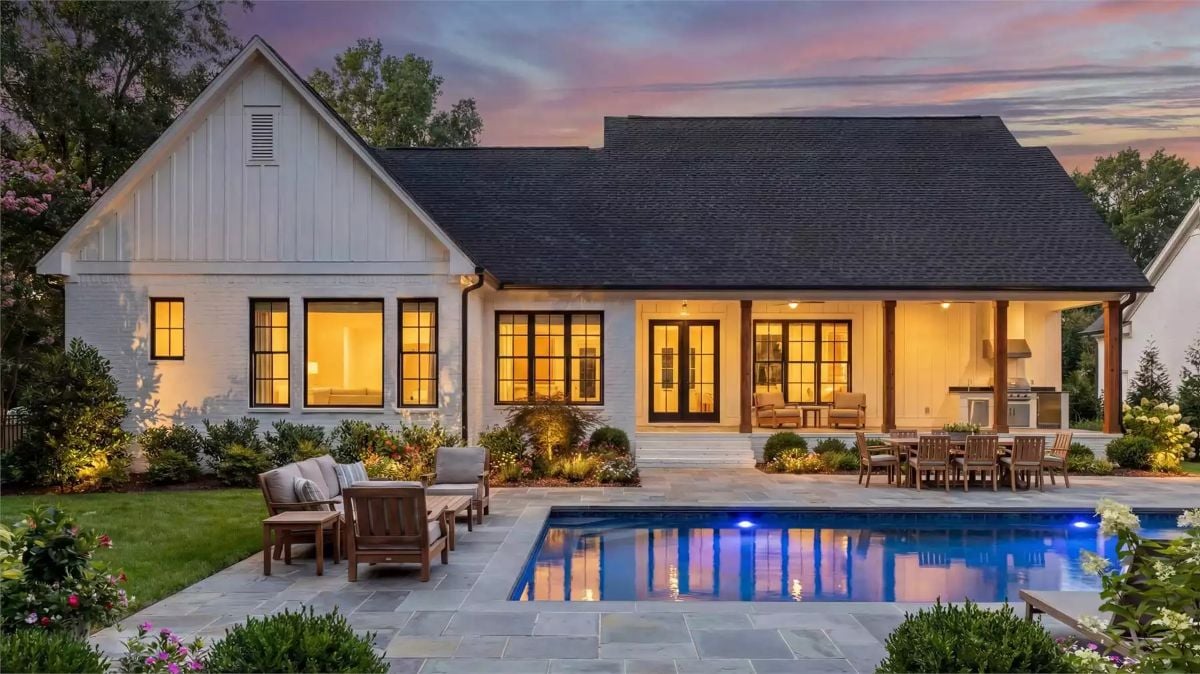 Poolside Covered Porch Brings Outdoor Living to a White Farmhouse Backyard
