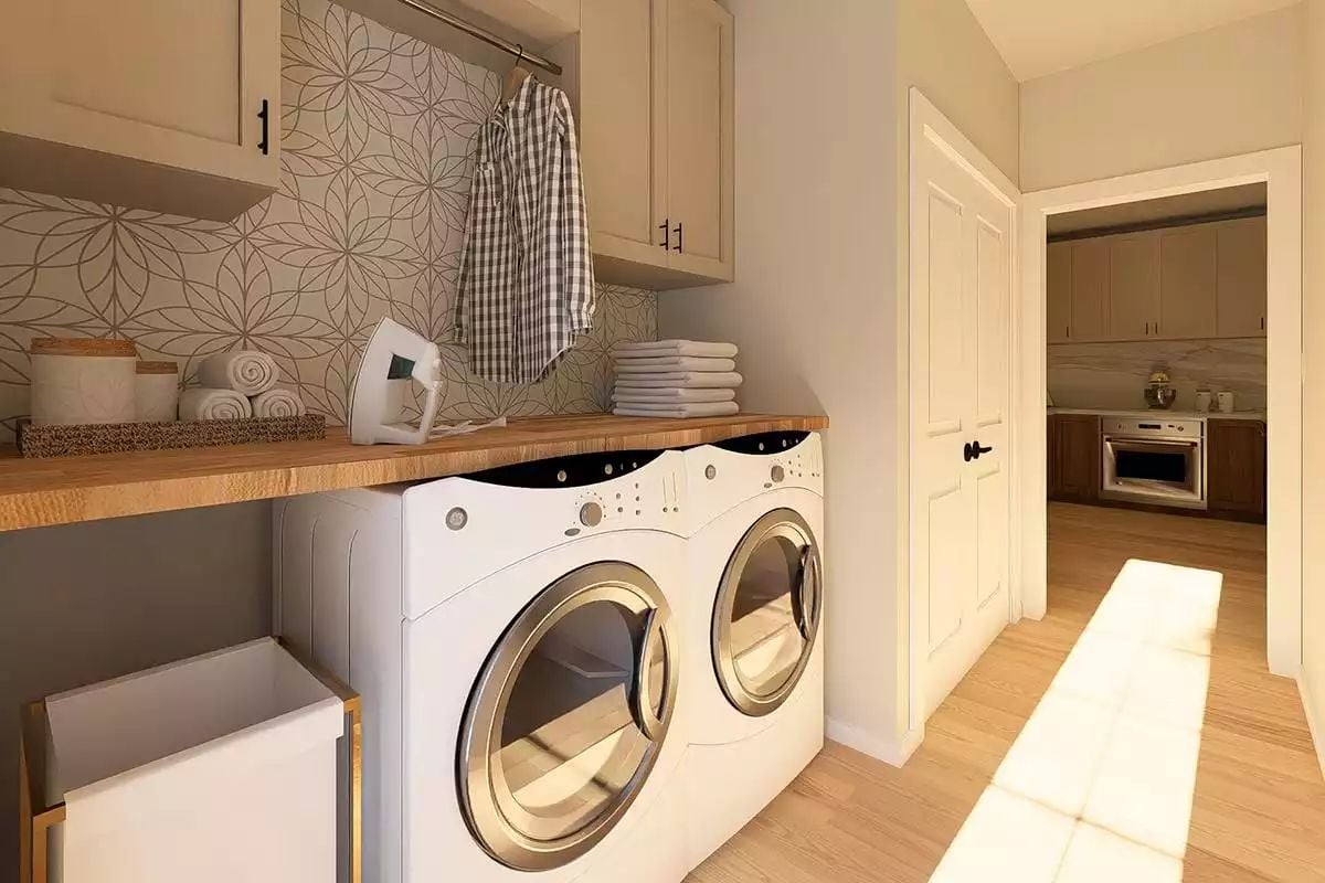 Butcher Block Counters and Patterned Wallpaper Ground a Functional Laundry Room