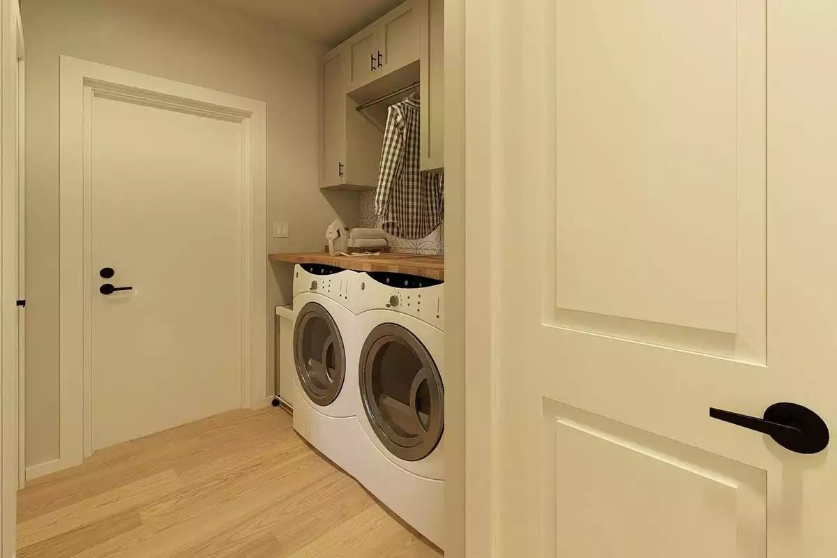 Butcher Block Countertop and a Hanging Rod Keep Laundry Day Practical