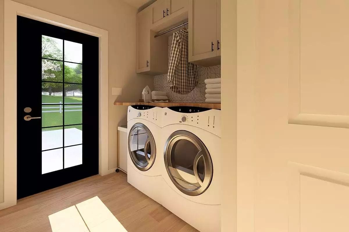 Butcher Block Counters and a Hanging Rod Keep Laundry Day Organized