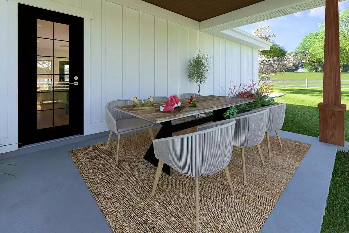 Covered Patio Dining With Rope Chairs and a Weathered Wood Table