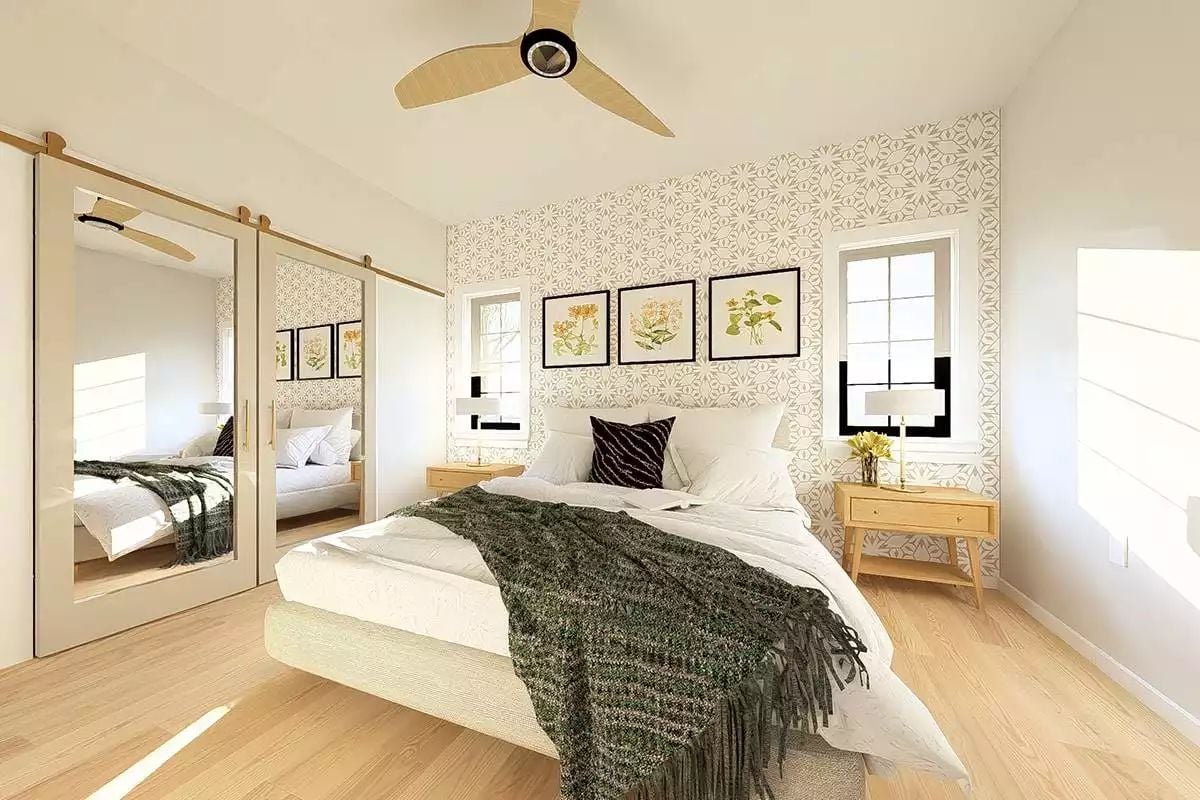 Mirrored Barn Doors and Botanical Prints Keep This Bedroom Grounded and Bright