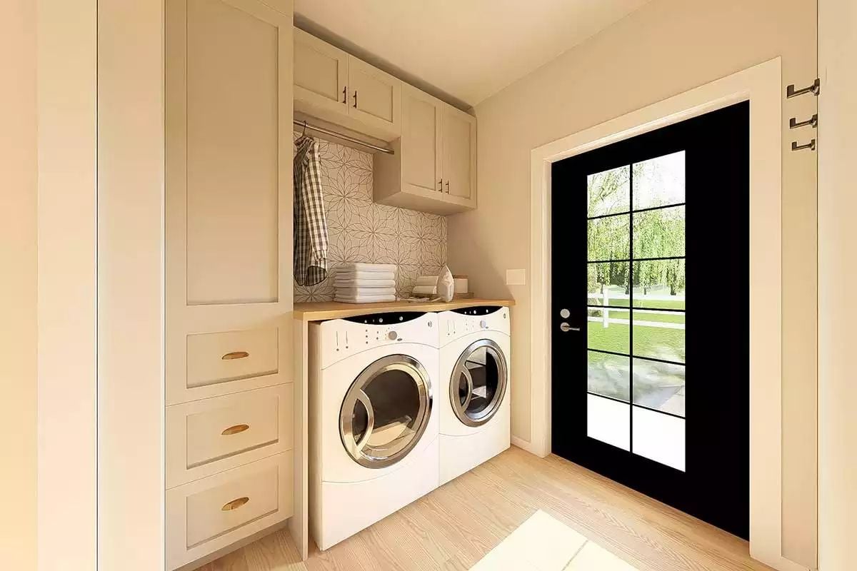 Built-In Hanging Rod and Wood Countertop Make Laundry Day Actually Manageable