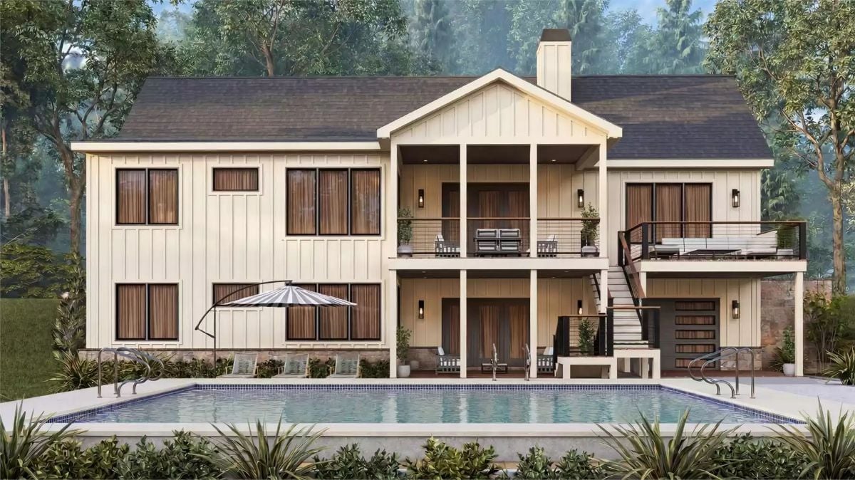 Covered Balcony, Pool Deck, and Vertical Siding Define This Rear Elevation