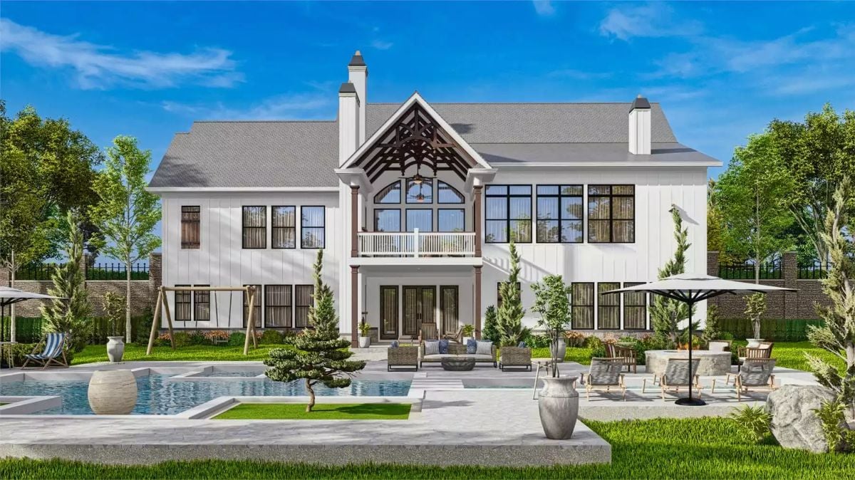 Backyard Pool and Covered Porch Anchor This White Farmhouse Design