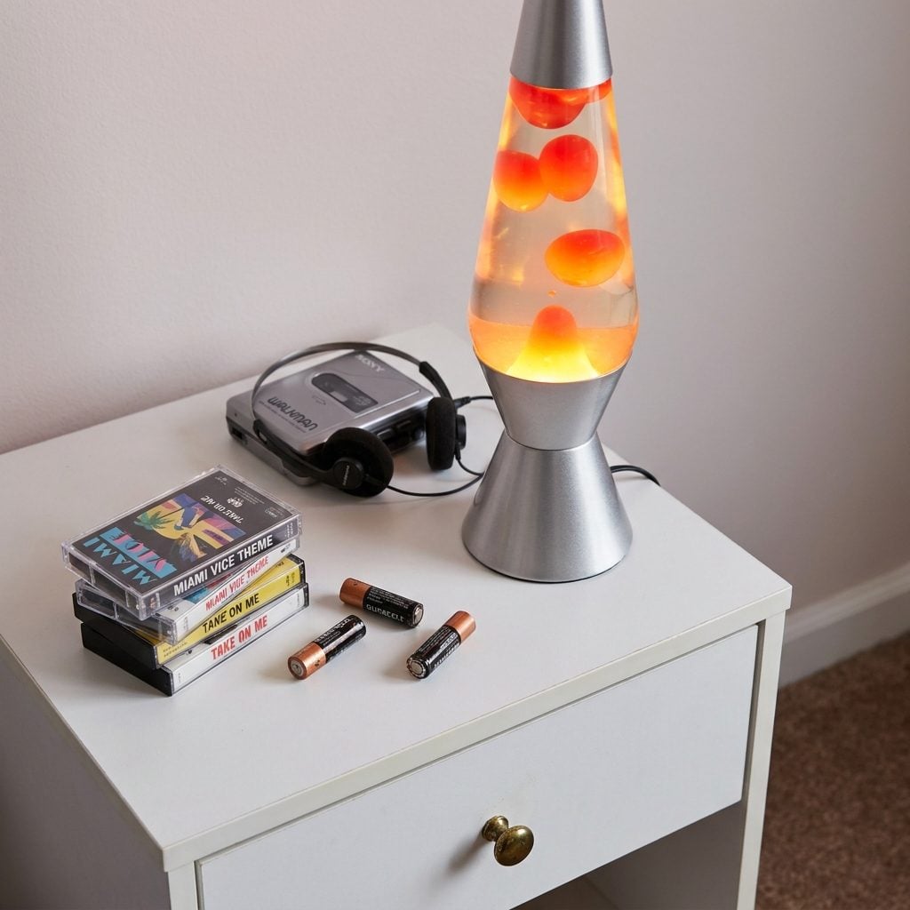 A Lava Lamp Bubbling Beside a Stack of Cassette Singles and Half-Used Batteries