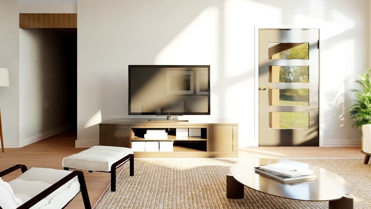 Warm Wood Tones and Sun-Drenched Walls Define This Minimalist Living Space
