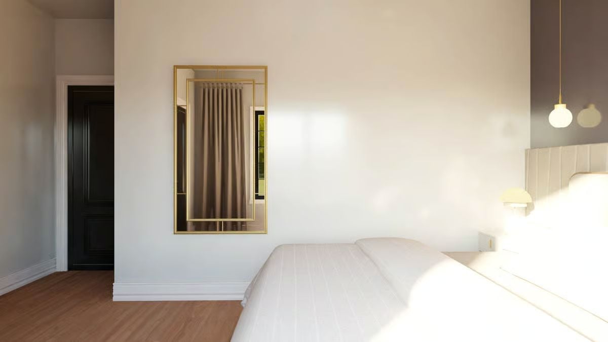 Gold-Framed Mirror and Pendant Globes Pull This Bedroom Together