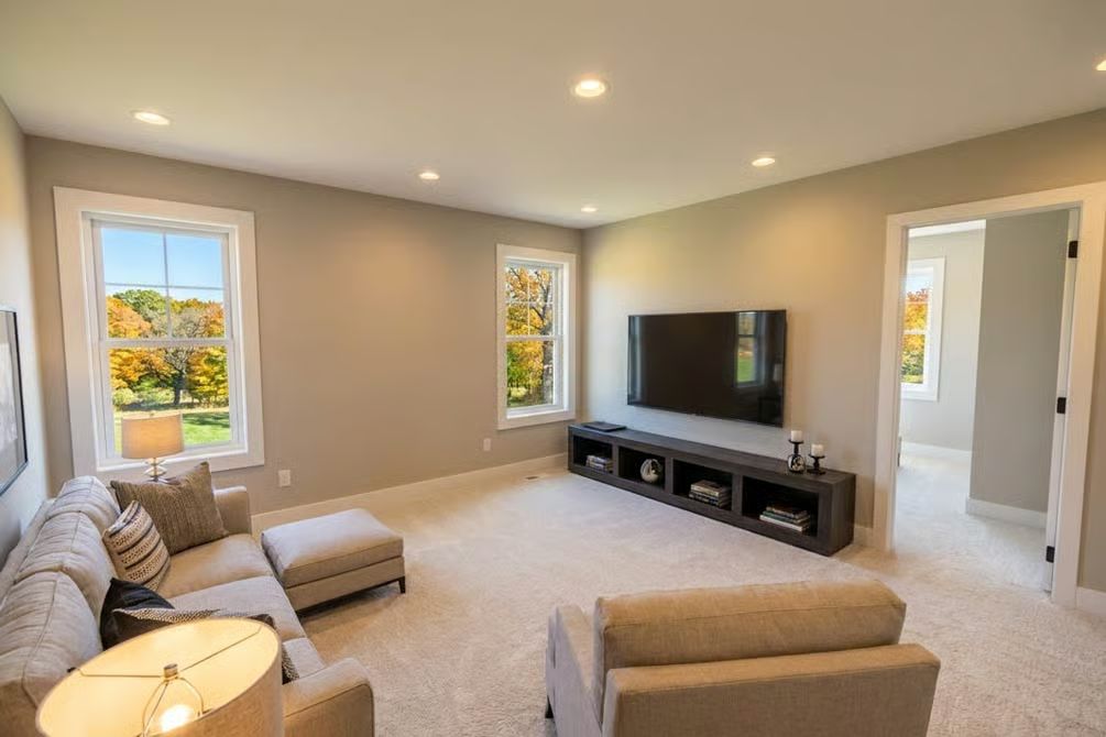 Carpet, Recessed Light, and a Floating Media Shelf That Keeps the Wall Clean