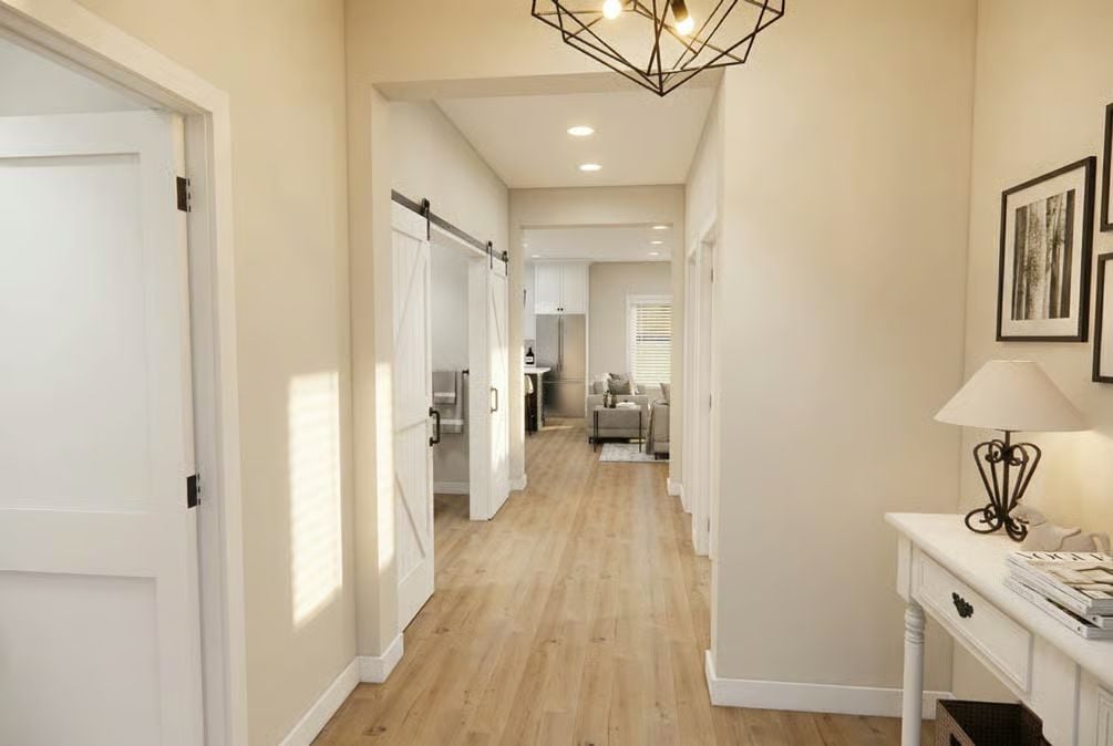 Barn Door Hardware and a Geometric Chandelier Set the Tone Here