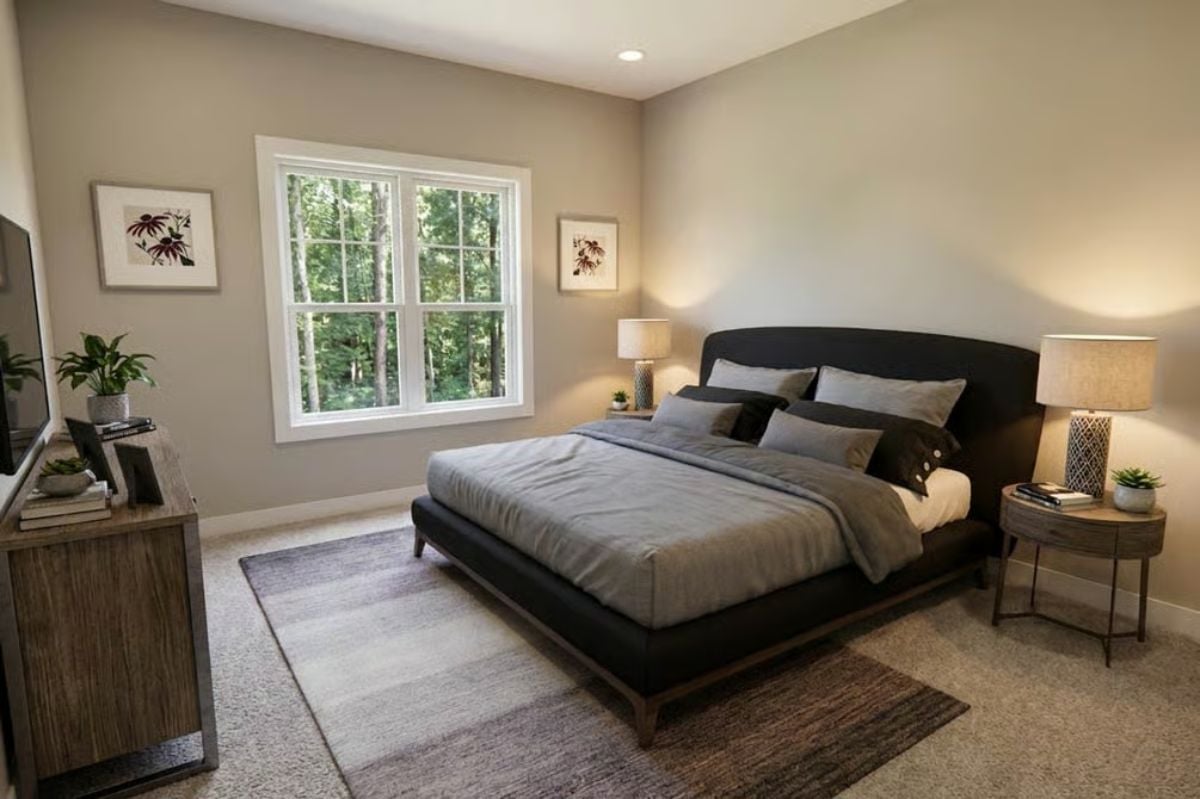 Low-Profile Bed Frame and Warm Lamp Glow Make This Master Bedroom Feel Grounded