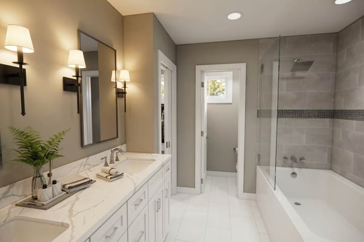Marble-Look Countertops and Warm Sconce Lighting Pull a Master Bath Together
