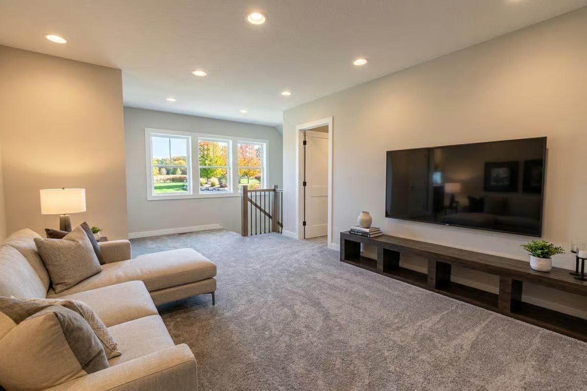 Carpeted Loft With a Low-Profile Media Console That Keeps Things Simple