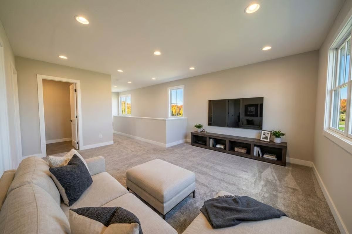 Loft Living Room With a Low-Slung Media Console and Soft Carpet Underfoot