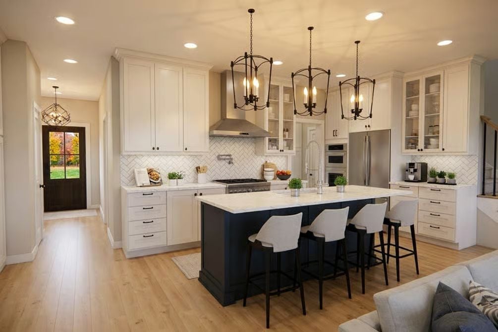 Navy Island Base and Iron Pendants Ground an All-White Kitchen