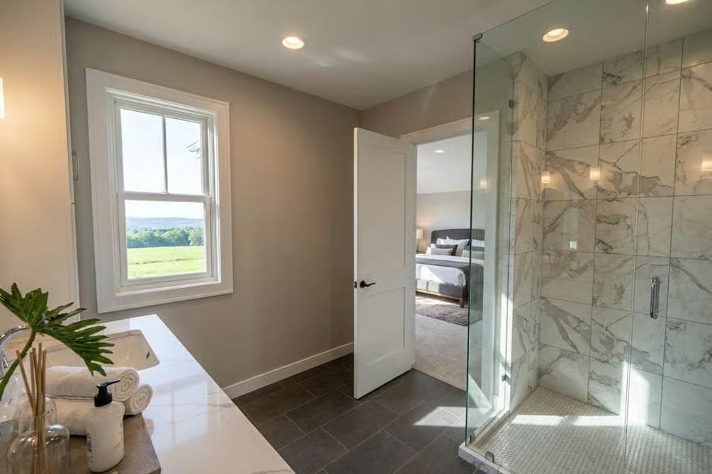 Marble Shower Surround and Rural Views Make This En Suite Worth the Upgrade
