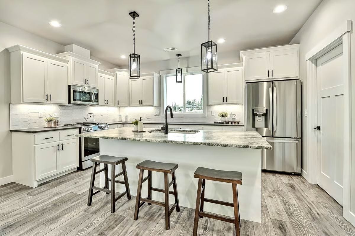 White Shaker Cabinets and a Marble Island Pull Kitchen Storage Into Plain Sight