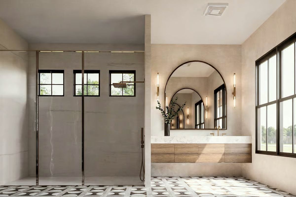 Arched Mirror and Brass Fixtures Set the Tone in This Spa-Like Bath