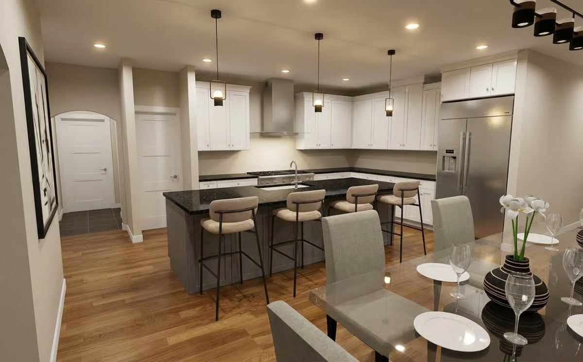 Dark Granite and Bar Seating Pull the Kitchen Into the Room