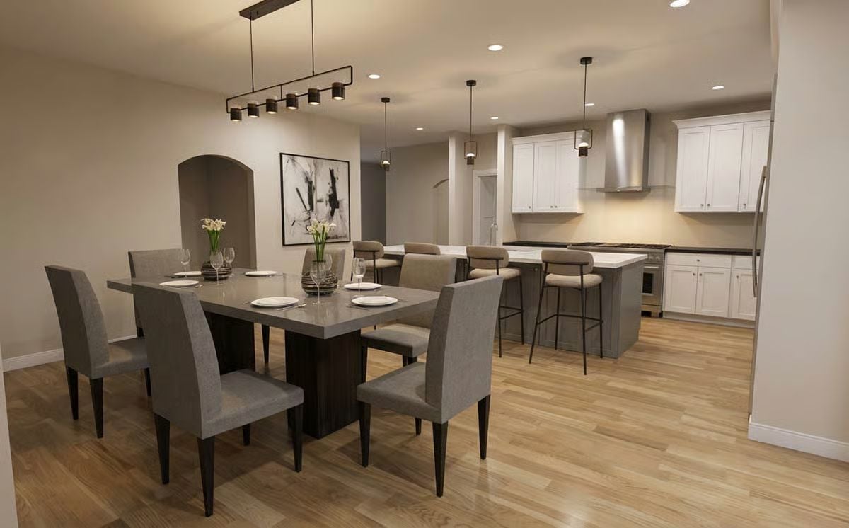 Gray Upholstery and Concrete-Look Surfaces Define the Dining Zone