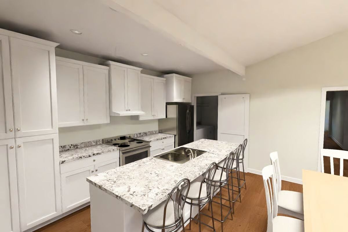 Granite Island with Sink and Bar Seating Earns Its Place in This Kitchen