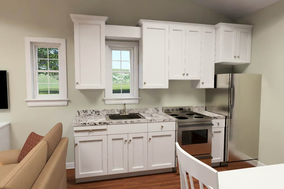 White Shaker Cabinets and Granite Counters Keep This Cottage Kitchen Honest