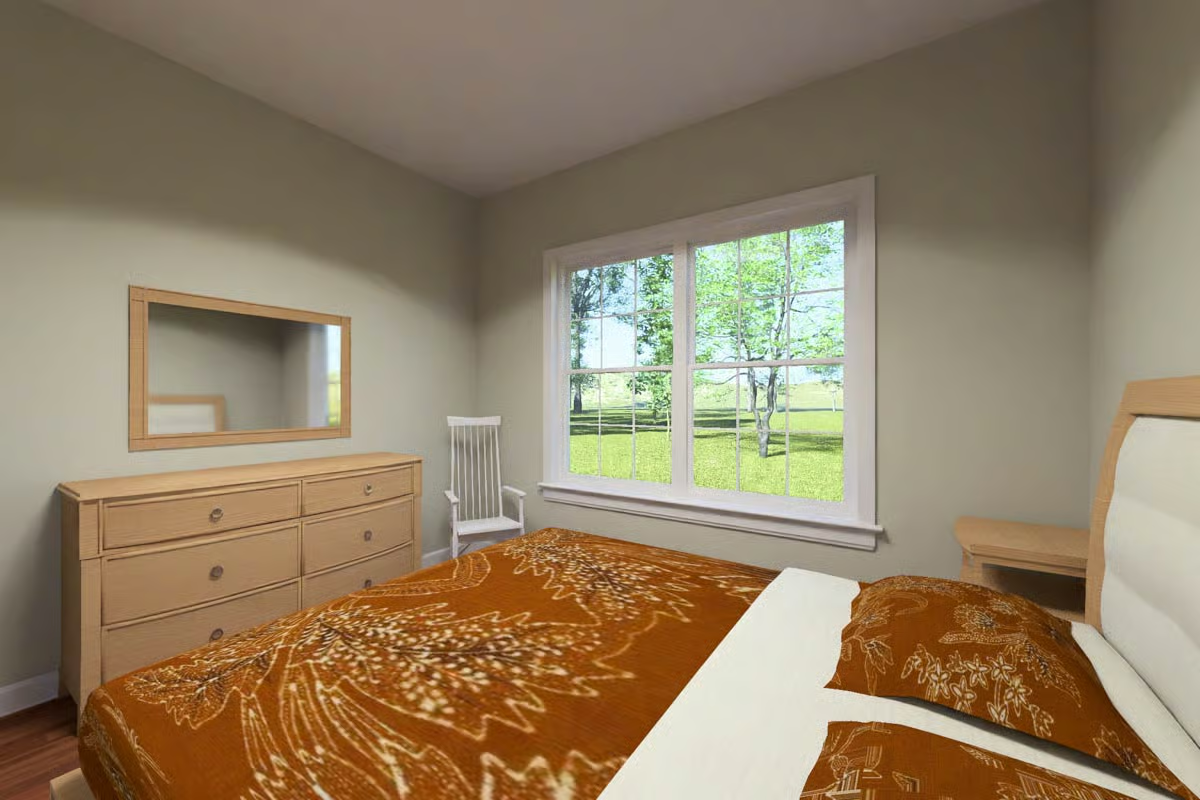 Rust-Toned Bedding and Natural Wood Furniture Give This Cottage Bedroom Grounded Appeal